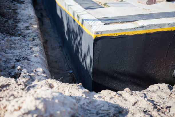 Professional Basement Waterproofing technician working in Satsuma, AL